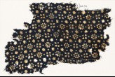 Textile fragment with rosettes, stars, and squares (EA1990.97)
