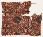 Textile fragment with pointed ovals and rosettes