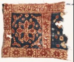 Textile fragment with square, a flower, stars, and Arabic inscription (EA1990.1015)