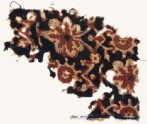 Textile fragment with vine leaves, flowers, and tendrils