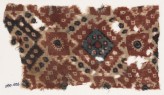 Textile fragment probably imitating patola pattern, with diamond-shapes and squares