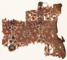 Textile fragment with lobed shapes, possibly leaves