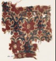 Textile fragment with interlacing tendrils, leaves, and flowers