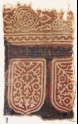Textile fragment with tab-shapes, linked rosettes, and an oval (EA1990.1082)