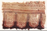 Textile fragment with tab-shapes and plants (EA1990.1083)