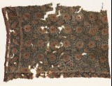 Textile fragment with flower-heads and tendrils