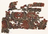 Textile fragment with stylized trees and bunches of fruit