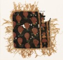 Textile fragment with dots, chevrons, and fringe, possibly from a place-mat or jar cover (EA1990.1193)