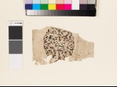 Paper fragment with circular design and inscription (EA1990.1232)