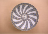 Plate with radial floral decoration and inscription
