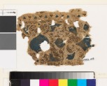 Textile fragment with swirling vegetal pattern and trefoil shapes