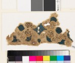 Textile fragment with swirling vegetal pattern and trefoil shapes