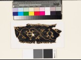 Textile fragment with scrolling stems, leaves, and palmettes