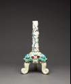 Tripod candlestick with three shishi heads and floral decoration
