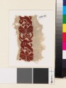 Textile fragment with stylized flowers, possibly a carnation and tulip