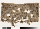 Textile fragment with remains of a roundel, octagon, square, and plant shapes