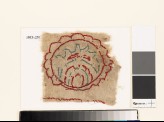 Textile fragment with multi-petalled circle and leaf