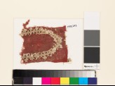 Textile fragment with shield-shape of linked crosses