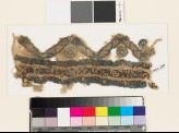 Textile fragment with chevrons, circles, and stars