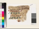 Textile fragment with chevrons and a floral scrolled stem (EA1993.290)