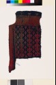 Textile fragment from the neck of a garment with linked diamond-shapes and lattice (EA1993.334)