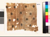 Textile fragment with stylized rosettes