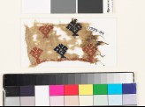 Textile fragment with floral shapes and possibly fish (EA1993.84)