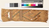 Textile fragment with geometric shapes and a diamond-shaped medallion