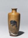 Baluster vase with a bear on a rock