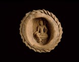 Votive plaque of a seated bodhisattva, possibly Padmapani