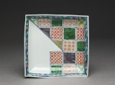 Plate with geometric decoration in the style of textile patterns