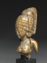 Female figure with a tall headress