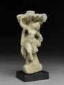Relief fragment depicting a female dancer beneath a tree (EA1997.4)