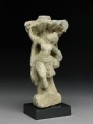 Relief fragment depicting a female dancer beneath a tree