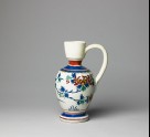 Jug with flowering plants