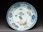 Dish with a bird on a flowering branch