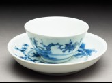 Cup and saucer with leaping tigers