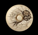 Manjū netsuke depicting the Earth Spider in a web