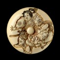 Manjū netsuke depicting Minamoto Yoshitsune practising martial arts with a tengu demon (EA2001.108)