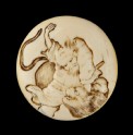 Manjū netsuke depicting Sanbushō fighting a tiger