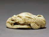 Netsuke in the form of a dragon coiled around a bowl (EA2001.125)