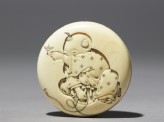 Manjū netsuke with a boy playing with a spinning top (EA2001.36)