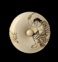 Manjū netsuke depicting a boy chasing away two oni, or demons (EA2001.37)