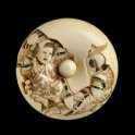 Manjū netsuke depicting a Sanbasō dancer and mask box bearer, with an uprooted pine sapling on the reverse (EA2001.41)