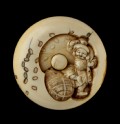 Manjū netsuke depicting Daikoku scattering coins for Ebisu (EA2001.64)