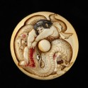 Manjū netsuke depicting Kintarō wrestling with a snake (EA2001.83)