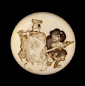 Manjū netsuke depicting Yasumasa playing his flute about to be attacked by the bandit Hakadamare