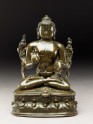 Seated figure of the Buddha with flowers, stupa, and bottle