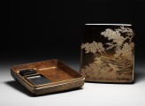 Suzuribako, or writing box, with cherry trees on a river bank