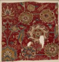 Mughal carpet fragment with scrolling vines and blossoms